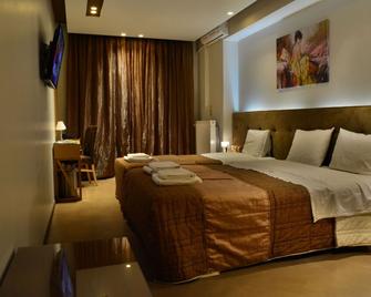 Trokadero Boutique Hotel - Itéa - Bedroom