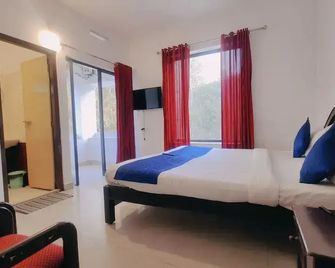 Karthika Residency - מונאר - חדר שינה