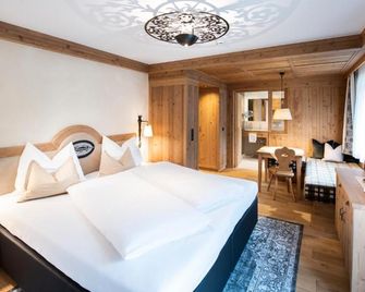 Alpenhotel Kramerwirt - מאיירהופן - חדר שינה