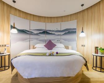 Q Hotel - Ťiang-men - Ložnice