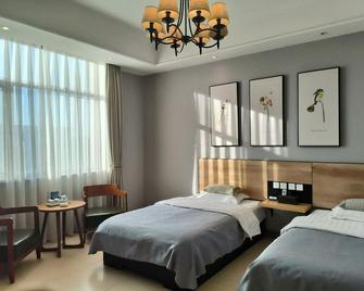 Kangen International Business Hotel - Baoding - Habitación