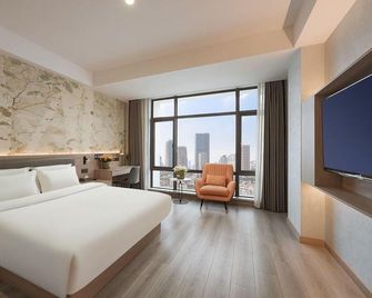 Sea Dream Hotel (Nanjing Olympic Sports Center Yingtian Street Subway Station Branch) - Nanjing - Slaapkamer