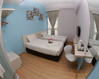 Sri Manja Boutique Hotel - קואנטאן - חדר שינה