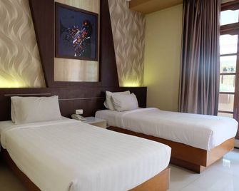 Votel Kartika Abadi Hotel Madiun - Madiun - Slaapkamer