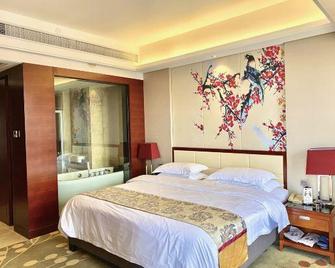 Unibo International Hotel (Ganzhou Station) - Ganzhou - Bedroom