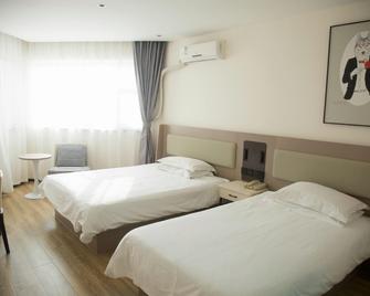 Grace Inn (Laiwu Fengcheng West Street Jiazhou Street) - Jinan - Schlafzimmer