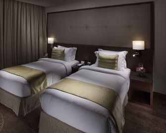 Ramee Rose Hotel - Manama - Schlafzimmer