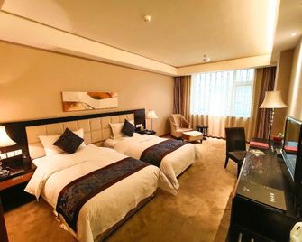 Oriental Lily Hotel - Lüliang - Bedroom