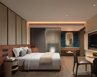 Jinli Royal Forest Hotel (Capitaland Mall Xinduxin Branch) - Qingdao - Habitación