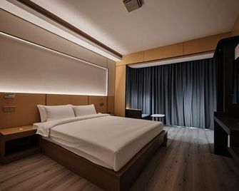 Taisenge Hotel - Xishuangbanna - Ložnice