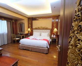 غراند أوركيد هوتل سولو - سوراكارتا - غرفة نوم