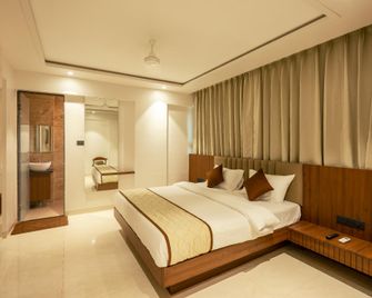 Diora Inn - Pune - Schlafzimmer