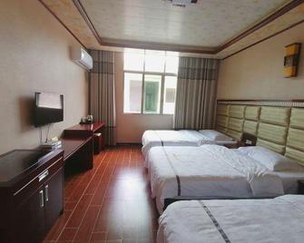 Huangguoshu Andu Hotel Guizhou Anshun - Anshun - Bedroom
