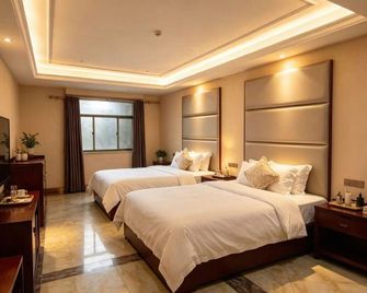 Rong Yi Hotel - זוני - חדר שינה