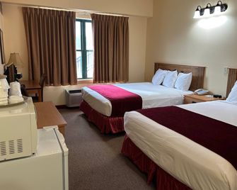 ترافلودج إن آند سويتس باي ويندام ديدوود - ديدوود - غرفة نوم