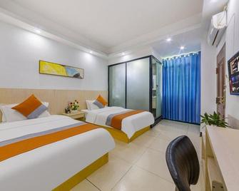 Bella Boutique Hostel - Haikou - Schlafzimmer