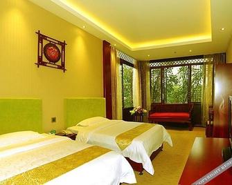 Lingxiu Impression Hotel - Leshan - Bedroom