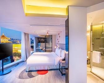 جينماو هوتل شيان داونتاون - زيان - غرفة نوم