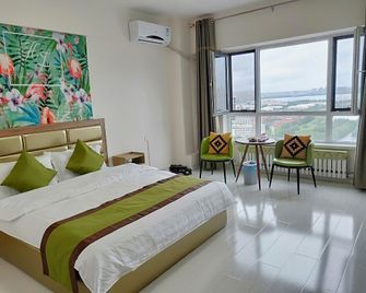 Spring Smart Hotel Apartments - Daqing - Schlafzimmer