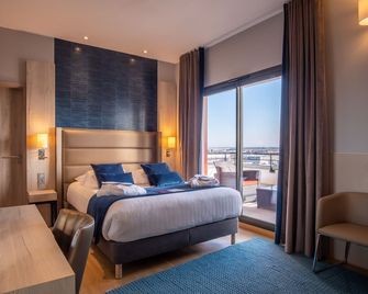 Kyriad Prestige Lyon Est - Saint Priest Eurexpo Hotel And Spa - Saint-Priest - Спальня