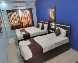 Hotel Landmaark Tiruppur - Tiruppur - Schlafzimmer