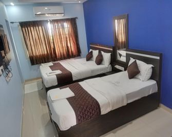 Hotel Landmaark Tiruppur - Tiruppur - Habitación