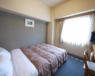 هوتل روت-إن يوكوهاشي - كيتاكيوشو - غرفة نوم