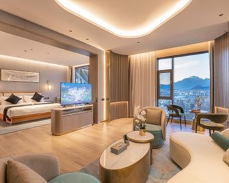 Lijiang Caizu Holiday Hotel - Lijiang - Sala de estar