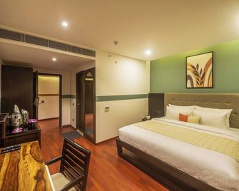 Olive Hotel MG Road Dunsvirk Inn by Embassy Group - Bengaluru - Bedroom