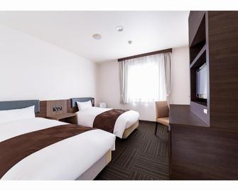 Hotel New Amami - Amami - Camera da letto