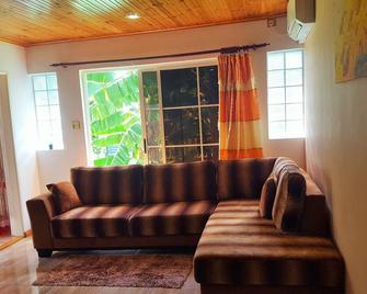 Wake up each morning with the SunRise right infront of you - Anse Etoile - Living room