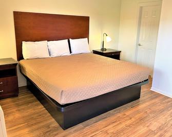 Budget Inn Giddings by Mukhi Hotels - Giddings - Bedroom