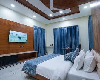 Matoshree Club and Resort - Pālampur - Camera da letto