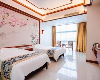 Wanguo Hotel - Haikou - Yatak Odası