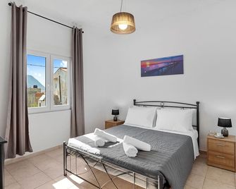 Bella-Maria at Aptera with mountain and sea view! - Aptera - Bedroom