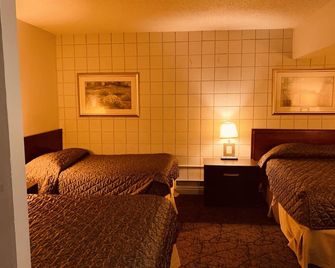 Red Carpet Inn & Suites - קלגרי - חדר שינה