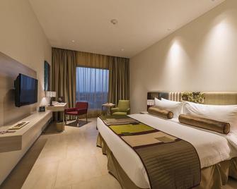 Jakson Inns - Phaltan - Bedroom