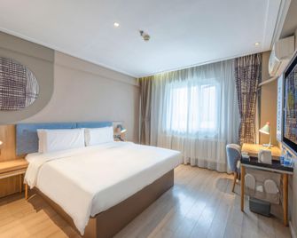 Home Inn Neo Changchun Railway Station - צ'נגצ'ון - חדר שינה
