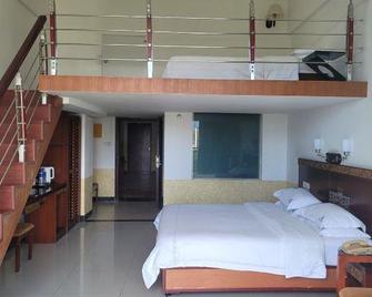 Qixian Riverside Hotel - Baoting - Bedroom