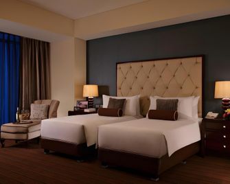 Joy Nostalg Hotel and Suites Manila Managed by The Ascott Limited - Pasig - Yatak Odası