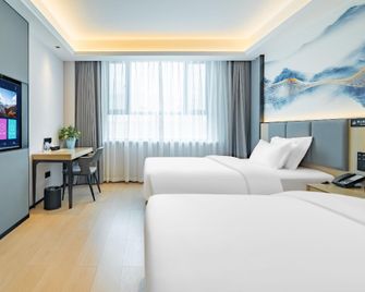 Changji Yirun Hotel (Xinhuijia Branch) - Changji - Bedroom