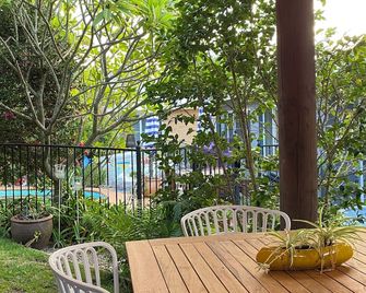 Beachside cabin + solar heated pool @ Spoon Bay - Forresters Beach - Patio