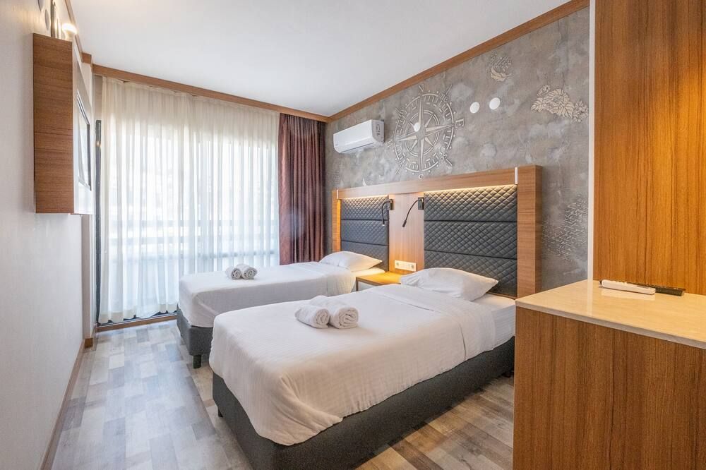 هوتل صنداي بيتش - كوساداسي - غرفة نوم