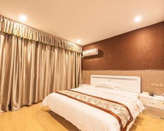 Baolongyuan Hotel Wuhu - Wuhu - Schlafzimmer
