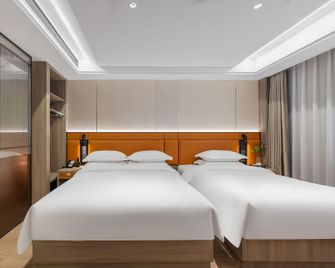 Yilong Anyun Hotel (Nantong Haohe Scenic Area Branch) - Nantong - Bedroom