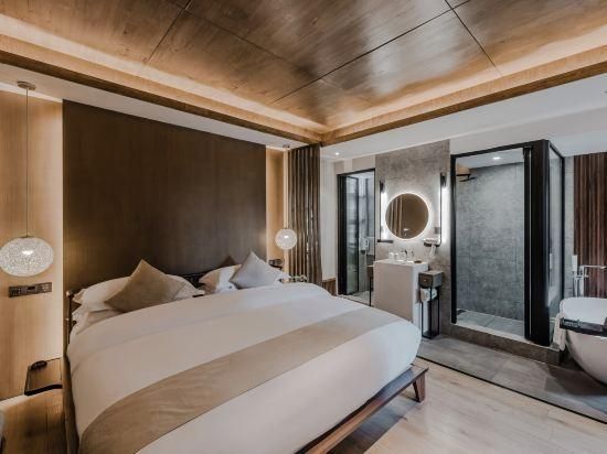 Jingli Yishu Boutique Inn - ליז'יאנג - חדר שינה