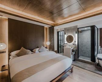 Jingli Yishu Boutique Inn - Lijiang - Yatak Odası