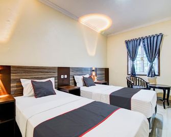 Collection O Kings Homestay - פקאנבארו - חדר שינה