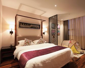 Junting Huafeng Hotel - Bozhou - Спальня