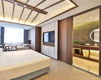 Mehood Lestie Hotel (Changchun Yiqi West Railway Station) - Changchun - Bedroom
